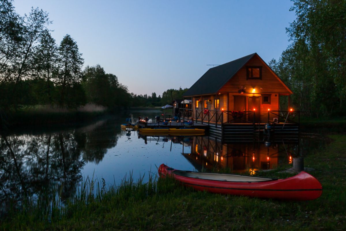 A small raft house at night